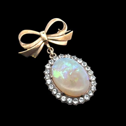 19 - An opal and white stone bow brooch. Opal approx 25mm x 18mm. Bow with Birmingham hallmarks. Length 5... 