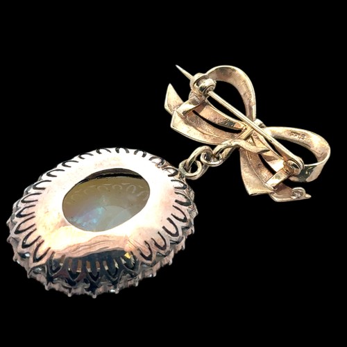 19 - An opal and white stone bow brooch. Opal approx 25mm x 18mm. Bow with Birmingham hallmarks. Length 5... 