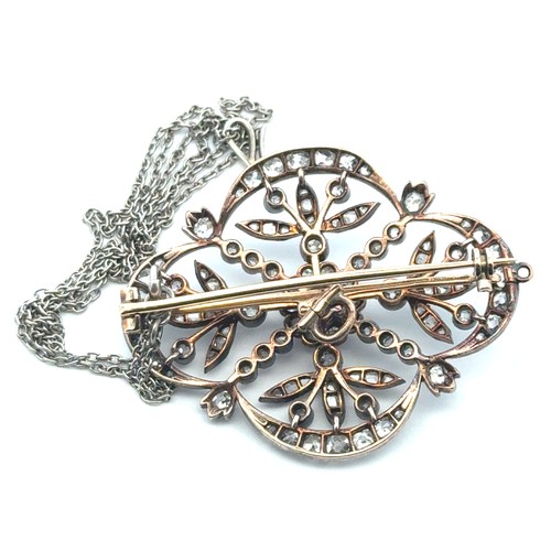 12 - A Victorian diamond brooch of quatrefoil openwork form with floral motif. The old cut diamonds (with... 