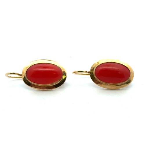 40 - A pair of 18ct gold and coral earrings.