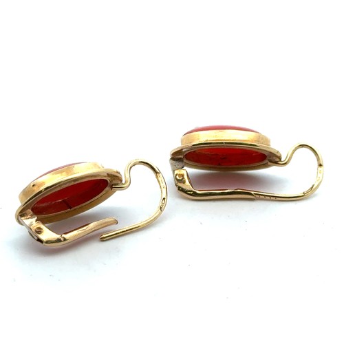 40 - A pair of 18ct gold and coral earrings.