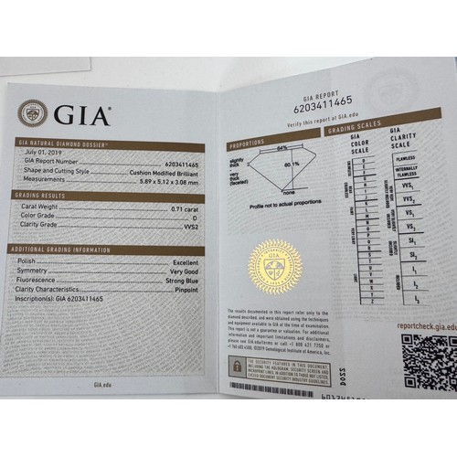 51A - A 0.71ct cushion cut diamond halo ring with diamond set shoulders, size I. Total diamond weight 0.93... 