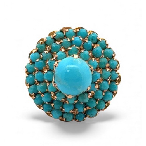 3 - A turquoise cluster set dress ring stamped 750, size Q. 5.83g