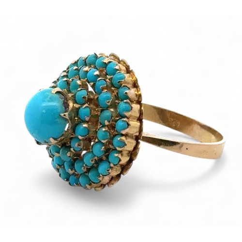 3 - A turquoise cluster set dress ring stamped 750, size Q. 5.83g