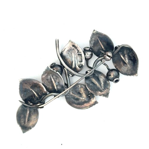 32 - Anton Michelsen -  a Danish silver brooch in the form of leaves and berries, with makers mark to rev... 
