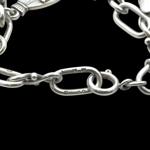 27 - A Georg Jensen silver charm bracelet, with 1959 London import hallmarks for Georg Jenson to one end,... 