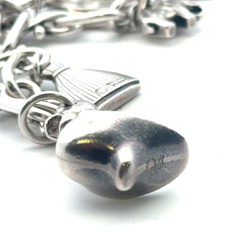 27 - A Georg Jensen silver charm bracelet, with 1959 London import hallmarks for Georg Jenson to one end,... 