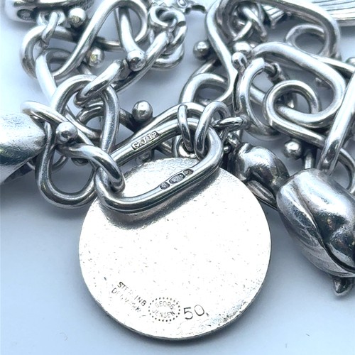 27 - A Georg Jensen silver charm bracelet, with 1959 London import hallmarks for Georg Jenson to one end,... 