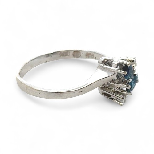 49 - A London topaz set ring with diamond accents stamped 585, size L/M. Diamond weight 0.03ct.