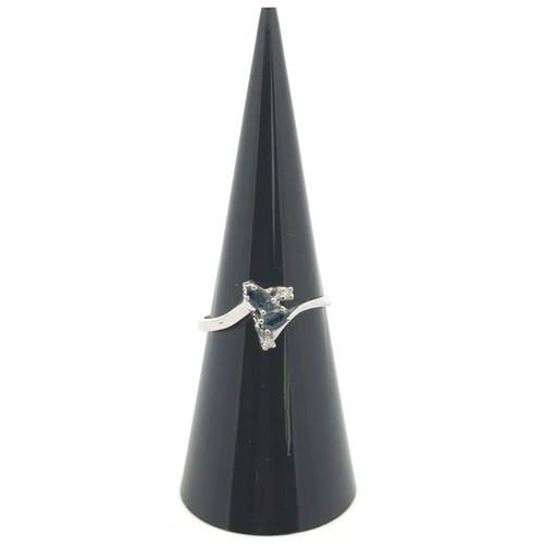 49 - A London topaz set ring with diamond accents stamped 585, size L/M. Diamond weight 0.03ct.