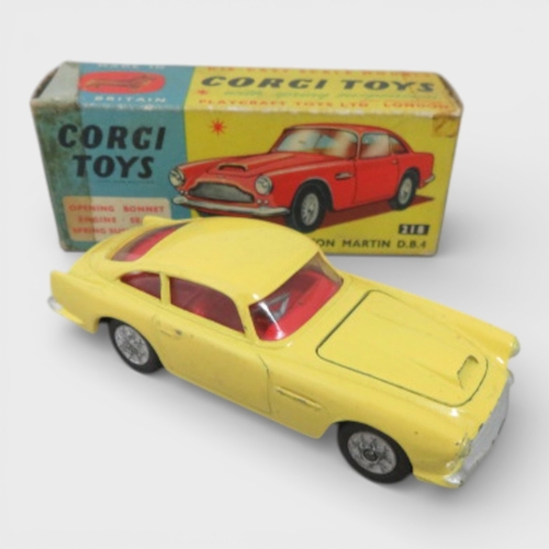 31 - Corgi No. 218 Aston Martin DB4, yellow with red interior and spoked hubs, generally excellent to goo... 