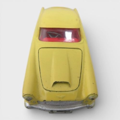 31 - Corgi No. 218 Aston Martin DB4, yellow with red interior and spoked hubs, generally excellent to goo... 