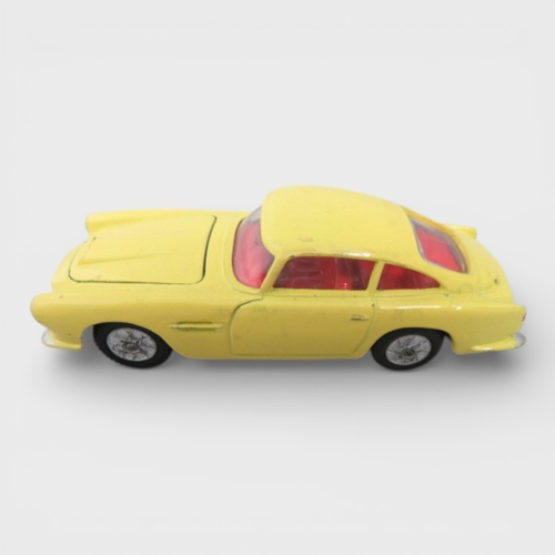 31 - Corgi No. 218 Aston Martin DB4, yellow with red interior and spoked hubs, generally excellent to goo... 