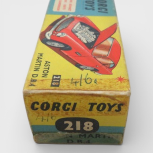 31 - Corgi No. 218 Aston Martin DB4, yellow with red interior and spoked hubs, generally excellent to goo... 