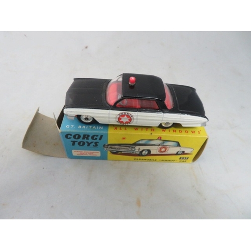 37 - Corgi No. 237 Oldsmobile County Sheriff black and white, generally excellent in good plus box (ink m... 