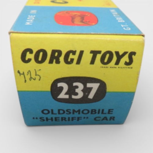 37 - Corgi No. 237 Oldsmobile County Sheriff black and white, generally excellent in good plus box (ink m... 