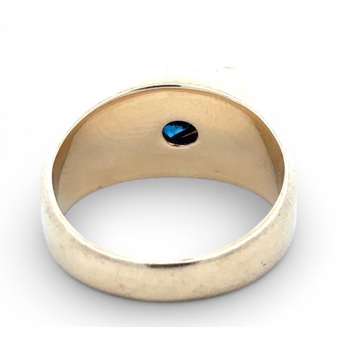 24 - A sapphire and diamond set signet ring stamped 14k. Size T