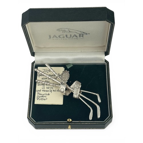 88 - A silver brooch modelled as three golf clubs held together by the Open Champion Belt, purported to h... 