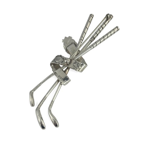 88 - A silver brooch modelled as three golf clubs held together by the Open Champion Belt, purported to h... 