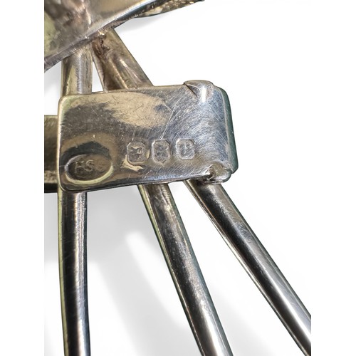 88 - A silver brooch modelled as three golf clubs held together by the Open Champion Belt, purported to h... 