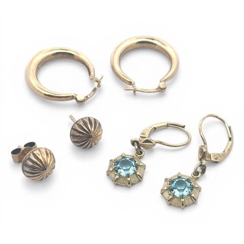 85 - Three pairs of gold earrings to include a pair of 9ct gold hoop earrings, a pair of 9ct gold circula... 
