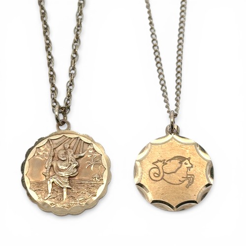84 - Two circular gold pendant necklaces, a St Christopher pendant and a Capricorn sea goat pendant. Both... 