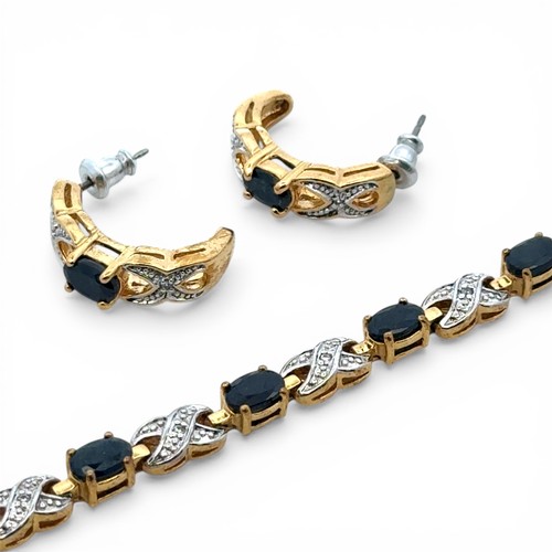 73 - A gold plated sapphire and white stone bracelet with matching half hoop earrings. Bracelet length ap... 