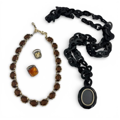 106 - Four jewellery items to include two rings and two necklaces:  a silver and quartz ring and a silver ... 