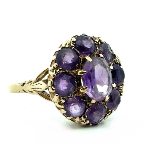 75 - A 9ct gold and amethyst cluster dress ring, size Q. Some stones with large chips. 7.29g