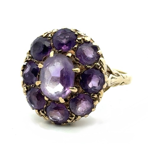 75 - A 9ct gold and amethyst cluster dress ring, size Q. Some stones with large chips. 7.29g