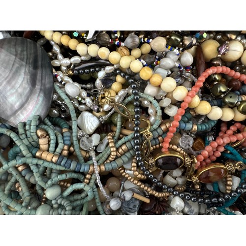 118 - A wooden sewing box containing jewellery, to include some single 9ct gold earrings, a Platinin marca... 