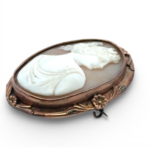 80 - A yellow metal cameo brooch, depicting the goddess Diana. Length 57mm, steel pin. 17.62g