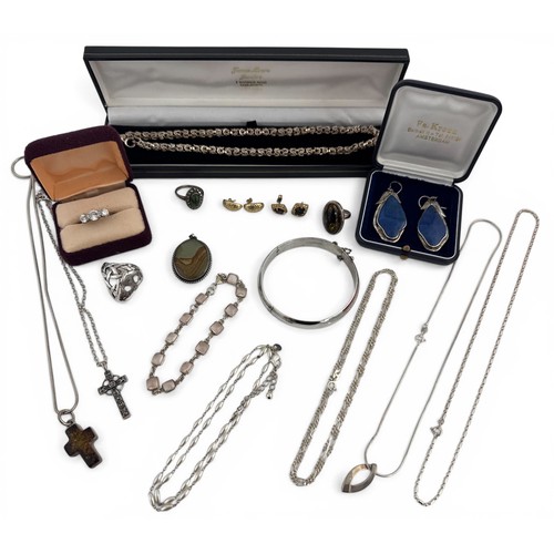 113 - A collection of silver/ 925 jewellery items, many set with gemstones, to include a a silver fancy li... 