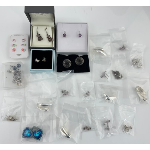 99 - Numerous pairs of silver / 925 earrings. Many set with gemstones.  Approx 30 pairs, a few missing ba... 