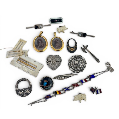 108 - A range of jewellery items. Includes a silver butterfly brooch, silver axe brooch, silver Viking shi... 