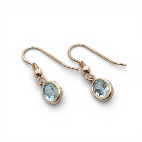 82A - A pair of topaz earrings, stamped 375.