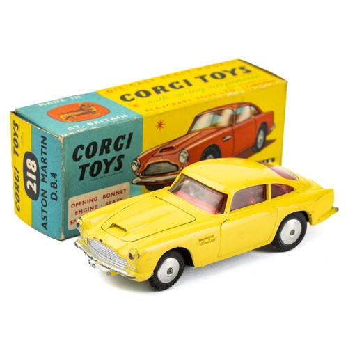 116 - Corgi 218 Aston Martin DB4, yellow with red interior and silver hubs, good (odd pin prick) in good b... 