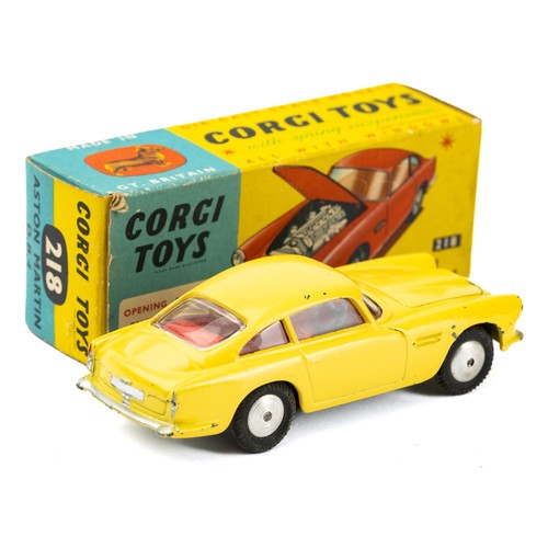 116 - Corgi 218 Aston Martin DB4, yellow with red interior and silver hubs, good (odd pin prick) in good b... 