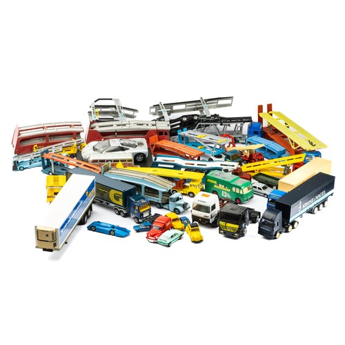 103 - Diecast collection of unboxed car transporters, lorries, cars etc, with ranges by Dinky, Matchbox an... 