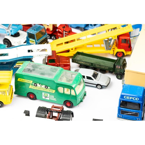 103 - Diecast collection of unboxed car transporters, lorries, cars etc, with ranges by Dinky, Matchbox an... 