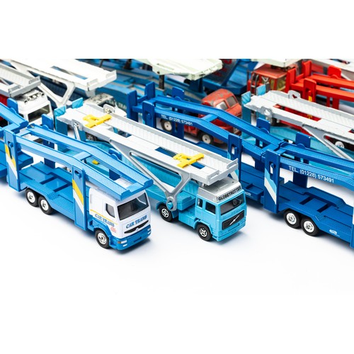 107 - Corgi car transporter collection with 14 unboxed transporters along with 3 accompanying empty boxes,... 