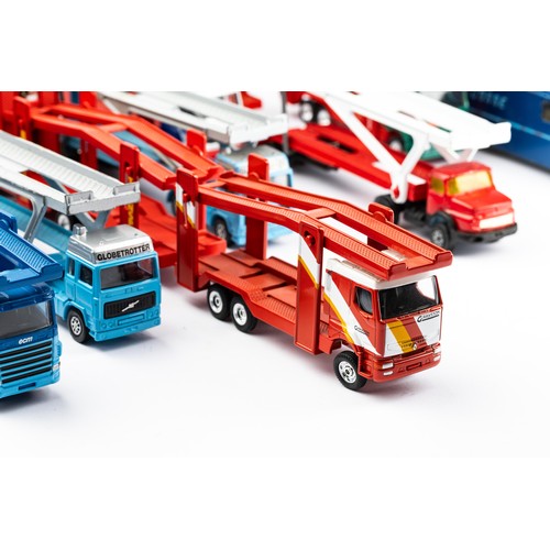 107 - Corgi car transporter collection with 14 unboxed transporters along with 3 accompanying empty boxes,... 