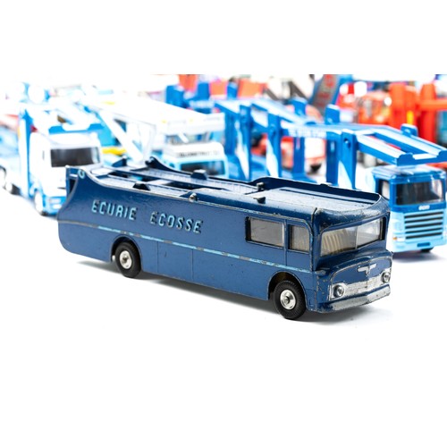 107 - Corgi car transporter collection with 14 unboxed transporters along with 3 accompanying empty boxes,... 