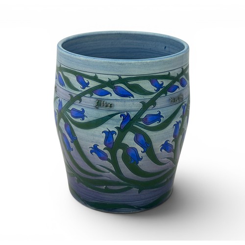 514 - Sally Tuffin for Dennis China Works - a barrel vase decorated with bluebells. Printed and painted ma... 
