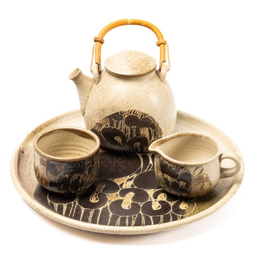 625 - Diane Worthy for Critch Pottery - a teapot, cream jug and sugar bowl with circular tray.  Impressed ... 
