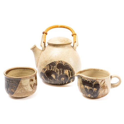 625 - Diane Worthy for Critch Pottery - a teapot, cream jug and sugar bowl with circular tray.  Impressed ... 