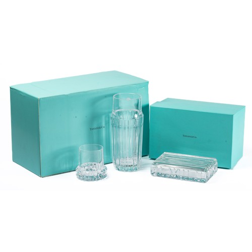 633 - Tiffany & Co, a pair of boxed Tiffany & Co glassware items. Includes; Tiffany & Co Aurora World Crui... 