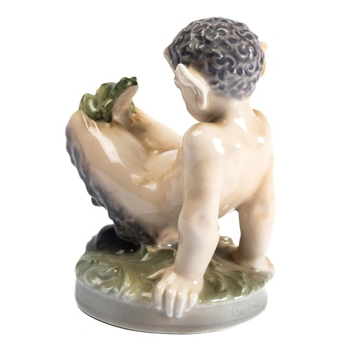 536 - Royal Copenhagen, a Royal Copenhagen faun with frog figurine, 1713. Stamped to base. Height 12cm.