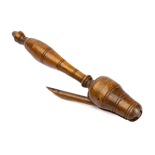 651 - A 19th century treen boxwood teacher's clicker, clicket or snapper, having turned acorn tip, 22cm lo... 