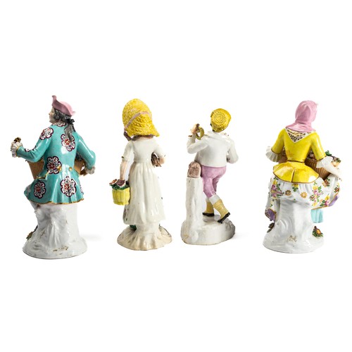 553 - Four 19th Century continental style porcelain figures. Fruit seller broken with torso in half, usual... 